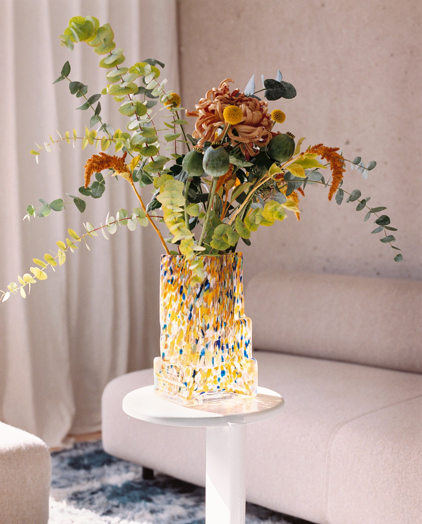 A lifestyle image featuring Brute Vase on a Lolly Side Table Pure White.