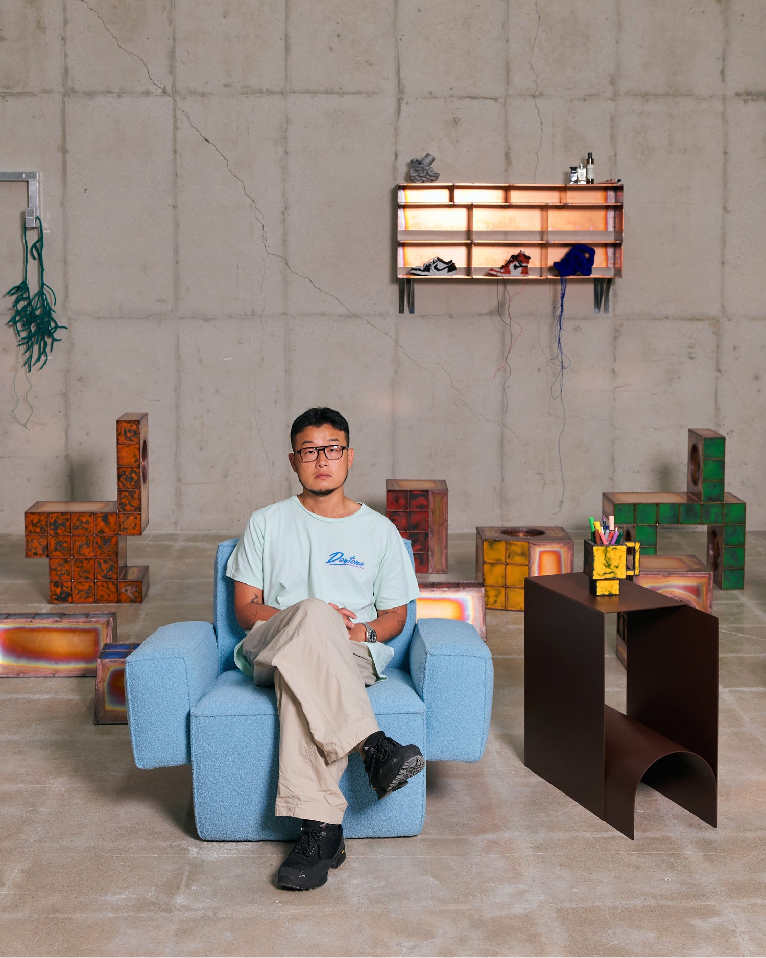 An editorial image from behind the scenes of making Hunk Lounge Chair and Glyph Side Tables by designer Kwangho Lee.