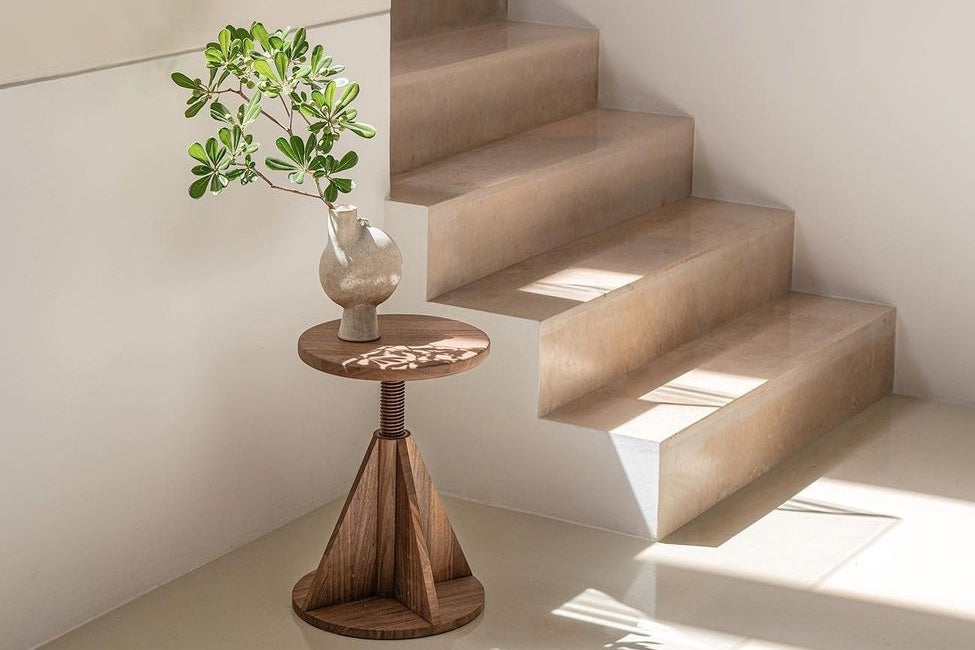 User generated content of an All Wood Stool Rocket in the shade Walnut with a vase and plant on top. 